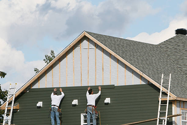Professional Storm Damage Siding Repair technician working in Elizabeth, CO
